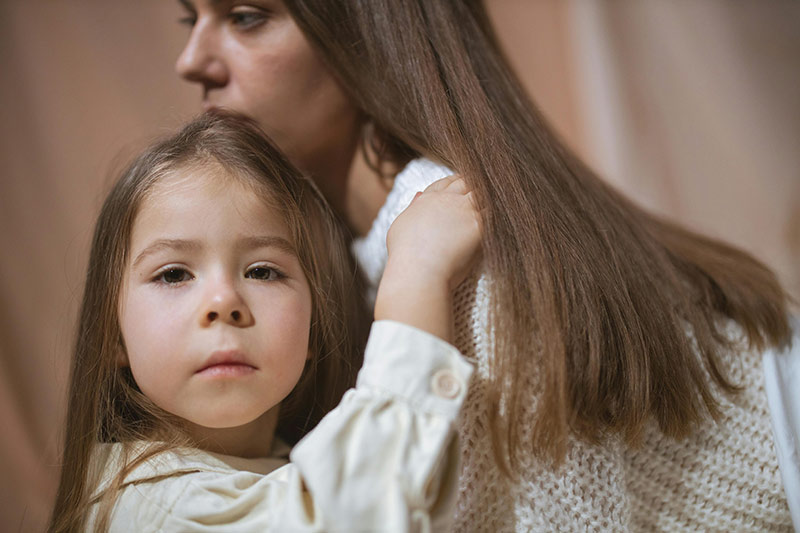 Child listening attentively during supportive conversation